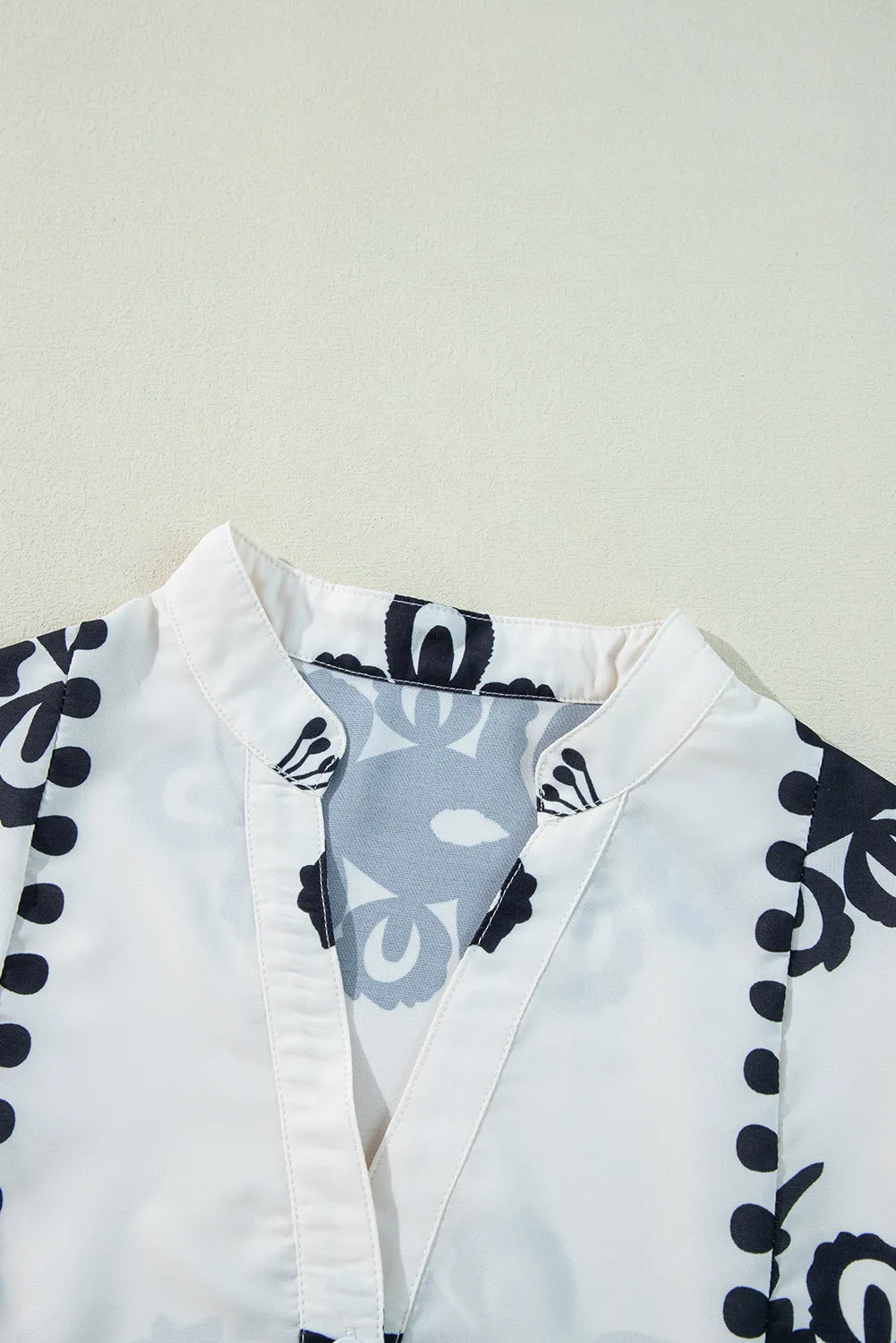 KaleaBoutique Stylish Abstract Printed Bell Sleeve Buttoned Tiered Babydoll Blouse